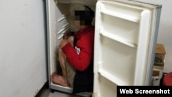 Cảnh sát Đài Loan phát hiện một lao động Việt trốn trong tủ lạnh. (Nguồn ảnh: Central News Agency).