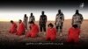 Hình ảnh từ video đăng tải ngày 3 tháng 1 năm 2016 cho thấy Nhà nước Hồi giáo hành quyết năm người đàn ông bị cáo buộc làm gián điệp cho Anh ở Syria.