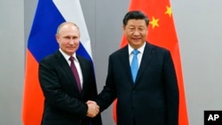 Tổng thống Nga Vladimir Putin và Chủ tịch Trung Quốc Tập Cận Bình tại Hội nghị thượng đỉnh các nước BRICS lần thứ 11 ở Brasilia, Brazil (ảnh chụp ngày 12/11/2019,