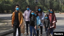 Volunteers wear masks as a preventive measure against the coronavirus in Peshawar