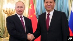 Tổng thống Nga và Chủ tịch Trung Quốc trong một cuộc gặp hồi tháng Bảy năm nay.